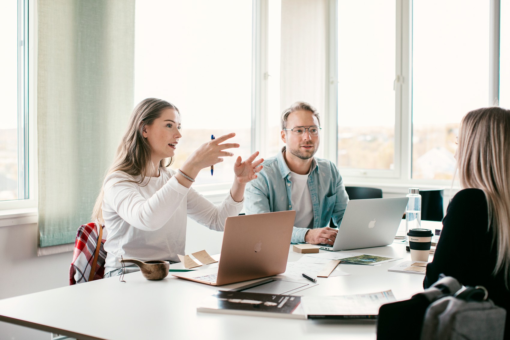 People talking around a meeting table